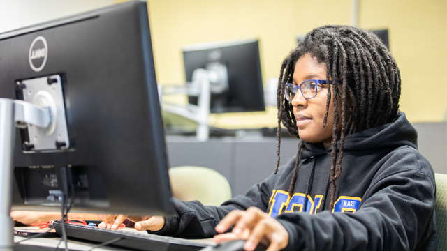 student studying at a computer